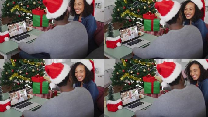 快乐的非洲裔美国夫妇在圣诞节与资深女性朋友进行视频通话