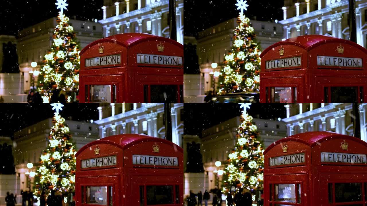 伦敦灯火通明的圣诞树前的经典红色电话亭