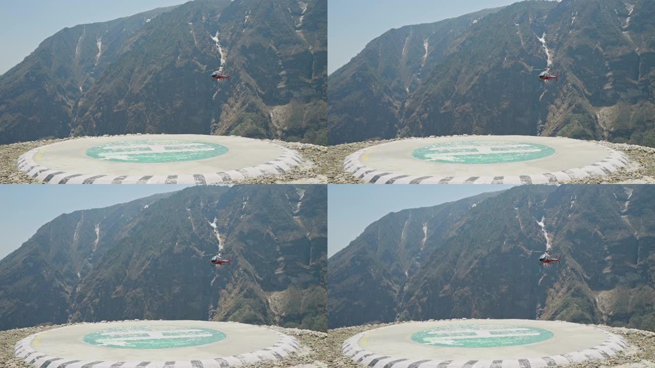 救援直升机在空中盘旋。直升机在山上的直升机场附近飞行