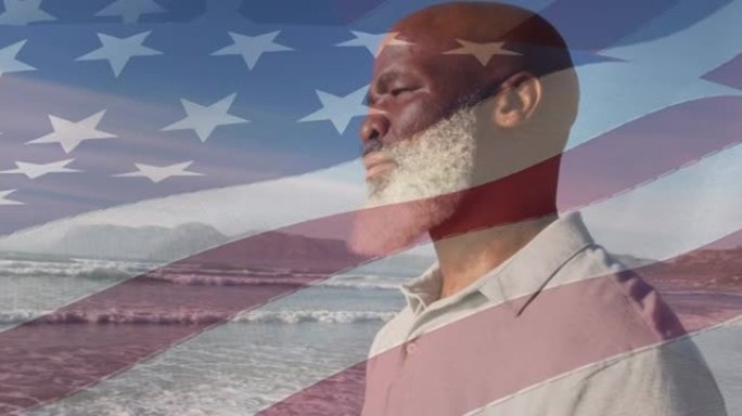 动画美利坚合众国国旗在资深非裔美国人在海滩上