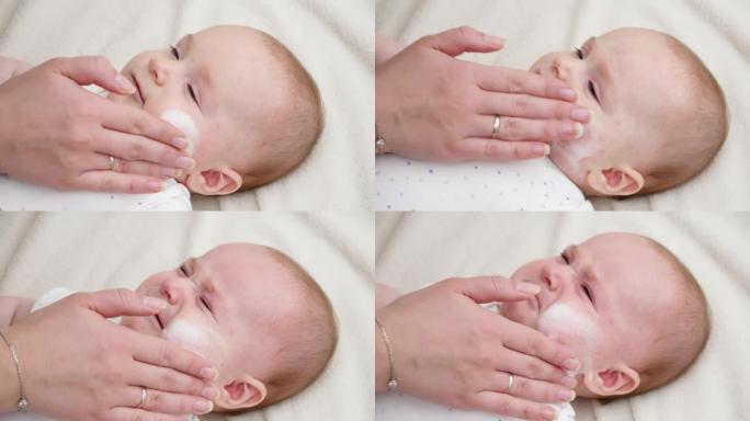 母亲用医用乳霜治疗新生儿有问题的皮肤。新生婴儿卫生、健康和皮肤护理的概念