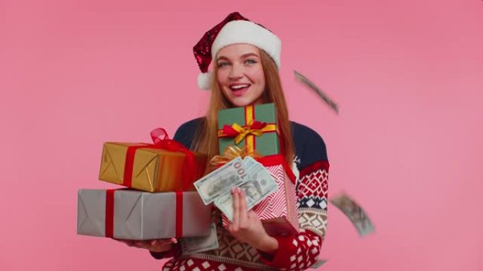 圣诞女孩拿着礼盒，消费概念，网上购物，现金美元下跌