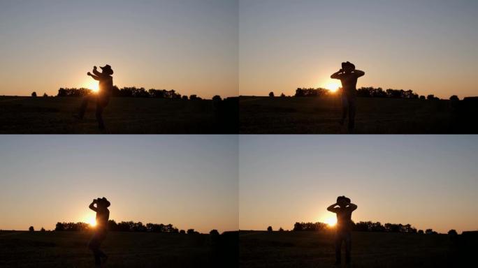 快乐的男性农民在日落时跳舞很开心。