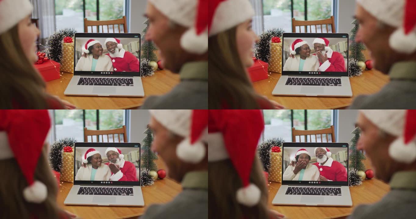圣诞节期间，高加索人的孙女和祖父与高级夫妇进行视频通话