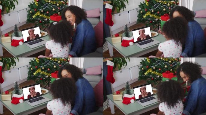 圣诞节期间与女性朋友进行视频通话的非洲裔美国母女快乐