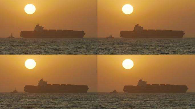 夕阳西下时，一个巨大的集装箱在海上移动，这是一个令人惊叹的长镜头