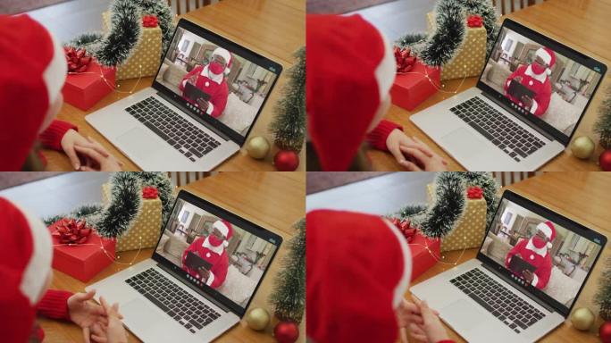 圣诞节时与圣诞老人进行视频通话的白人妇女