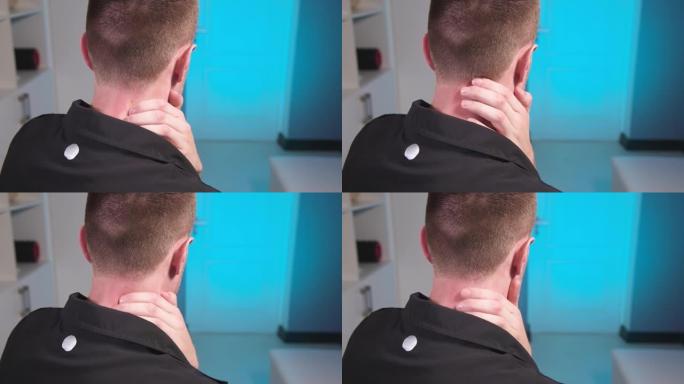 年轻的白人男性按摩师对自己做自我颈部按摩。特写。肌筋肌释放