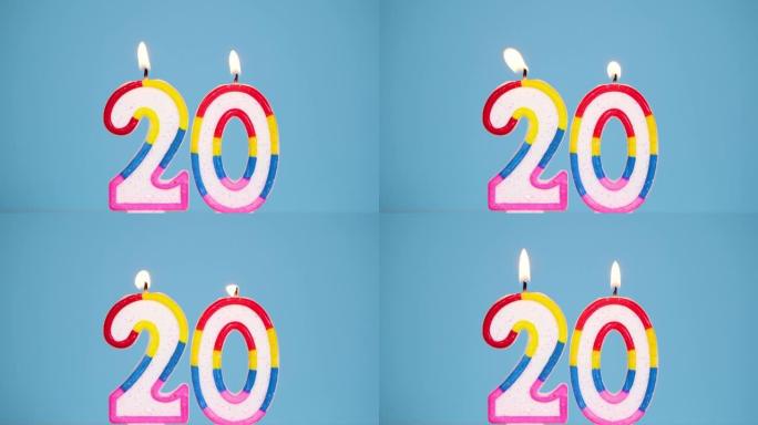 周年视频横幅，蓝色背景上燃烧着五颜六色的22号蜡烛。4k分辨率周年横幅