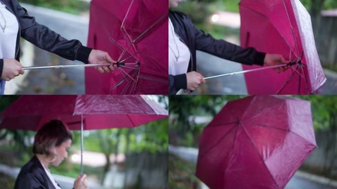 年轻女子在雨中行走时在城市街道外面打开雨伞