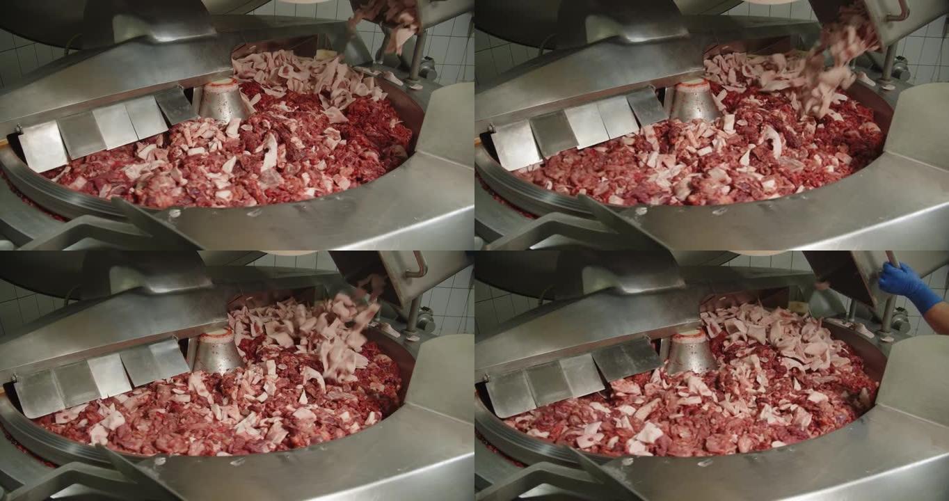 用猪油和香料在大离心机中磨肉... jpg
