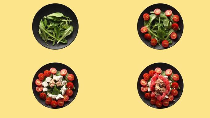 芝麻菜，樱桃番茄，葡萄柚，软奶酪和金枪鱼的健康沙拉，定格视频顶视图
