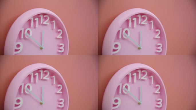 粉色墙上的单个粉色钟