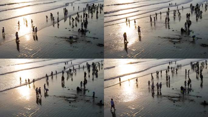 海南省三亚市三亚湾耶梦长廊沙滩的旅游游客