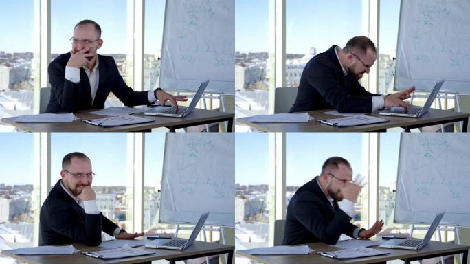 有趣的商人在笔记本电脑上打字。戴着眼镜的办公室工作人员坐在工作场所的办公桌前，发疯。业务中的问题。