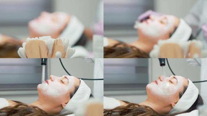 病人面部涂抹和专家在皮肤上使用高频d'arsonval装置 -- 医疗办公室的下巴和脸颊