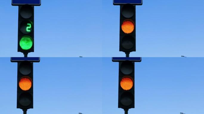 一个红色的交通灯对着天空亮起。