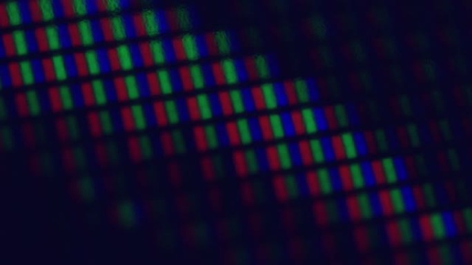 显微镜下的液晶屏幕像素。矩阵屏幕的宏观拍摄，像素纹理。视频背景。采用RGB色调技术的发光二极管显示器