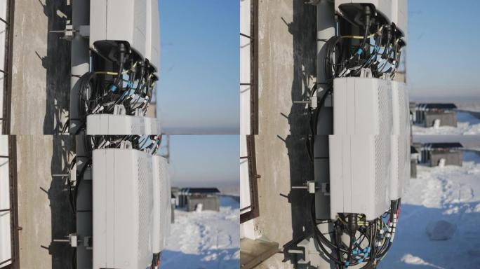 移动通信中继器安装在建筑物的屋顶上。拍摄于阳光明媚的冬日