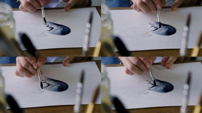在艺术工作室里，用画笔用水彩画一颗蓝色的心。4K
