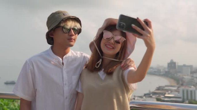 开朗的亚洲年轻夫妇游客当地旅游，年轻人的关系。