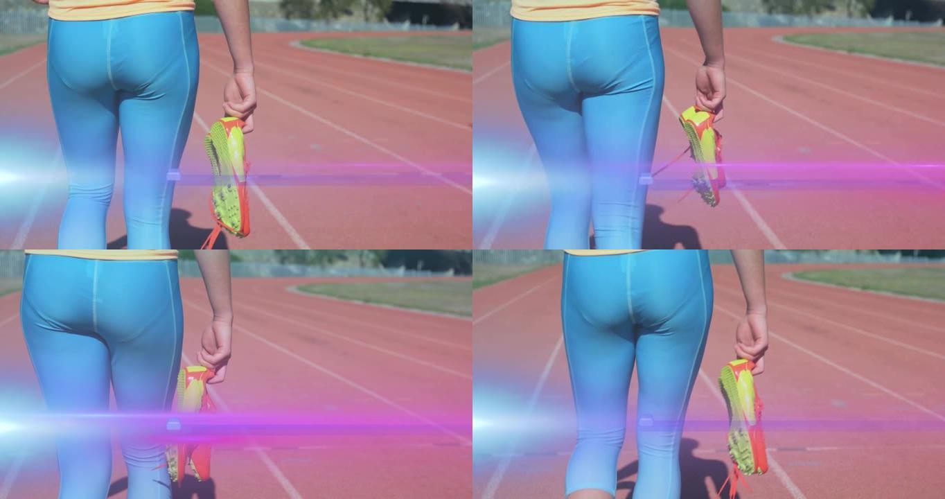 手持跑鞋在跑道上行走的女人的中段上移动的灯光动画