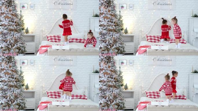 孩子们跳起来，在父母卧室的床上玩得开心，上面装饰着圣诞节，背景是砖白墙。