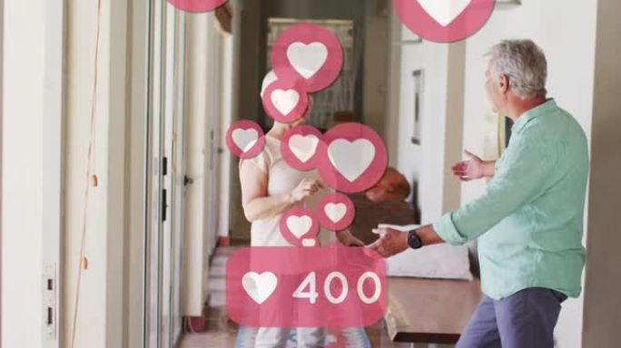 社交媒体心脏图标的动画，数字超过高级夫妇跳舞