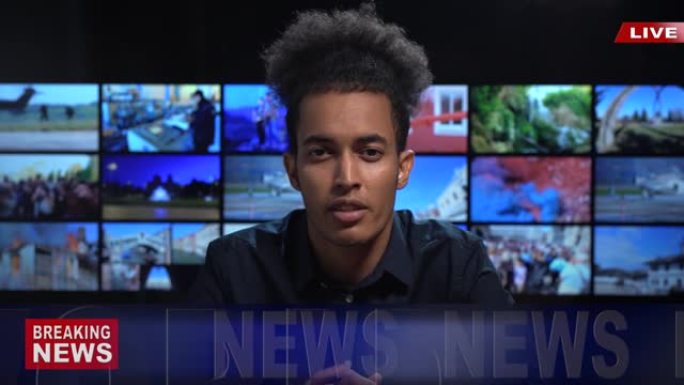 4k视频: 非洲男性新闻播音员在电视演播室阅读突发新闻