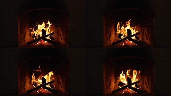 壁炉里燃烧着火。带有中型火焰的壁炉的循环夹
