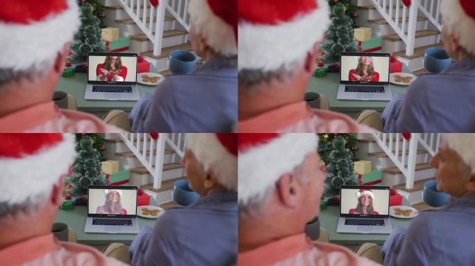 快乐的高加索高级夫妇在圣诞节与成年女儿进行视频通话