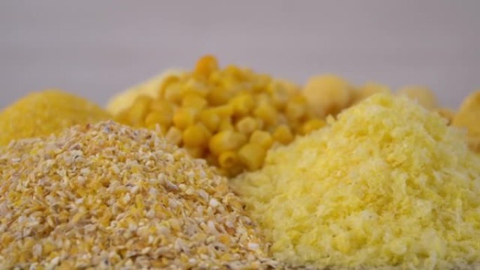 特写。玉米食品的种类。面粉，谷物和玉米粒堆