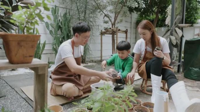 充满爱情感的小花园亚洲家庭抚育植物的快乐时光-股票视频