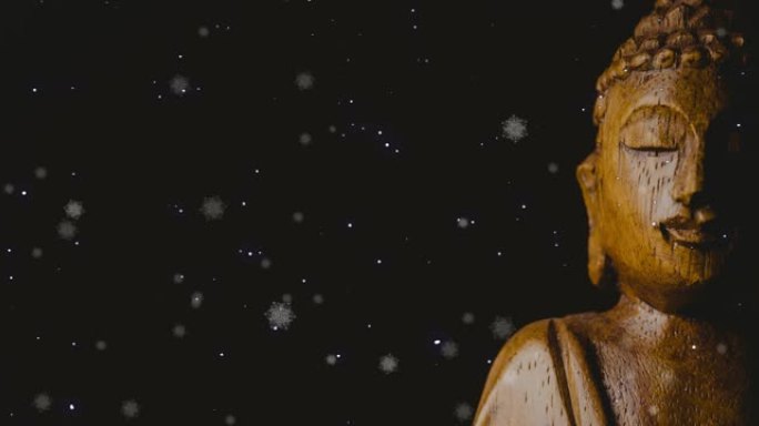 黑色背景上的雪落在佛陀上的动画