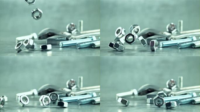 一堆坚果落在桌子上。拍摄的是1000 fps的慢动作。