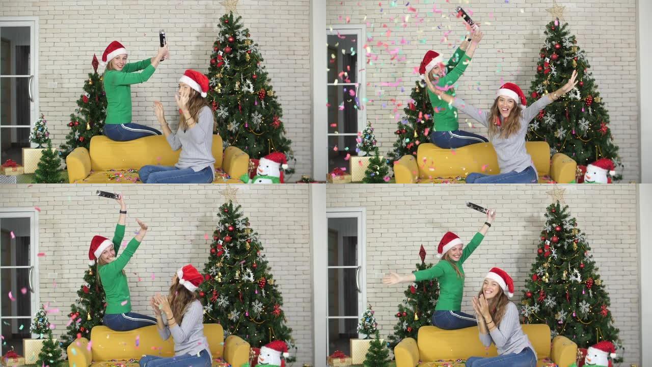 快乐的高加索女人在圣诞派对上，一边扔五颜六色的五彩纸屑，一起玩乐，慢动作拍摄