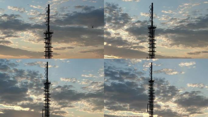 伊尔库茨克市上空的黎明。太阳从电视塔上空升起。燕子在旭日的背景下飞过。从无人机上射击。顶视图