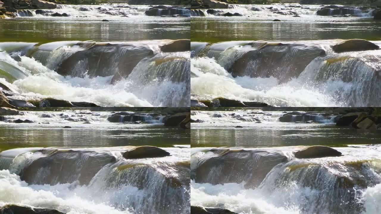 山河，清澈的绿松石水在湿石块之间的梯级中落下，白色泡沫浓厚