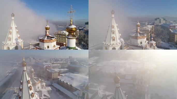 伊尔库茨克主显节教堂主教座堂。空中无人机飞行。冬季，俄罗斯城市冰雪覆盖。