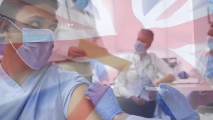 英国国旗在女医生面罩上的动画为男性患者接种covid疫苗