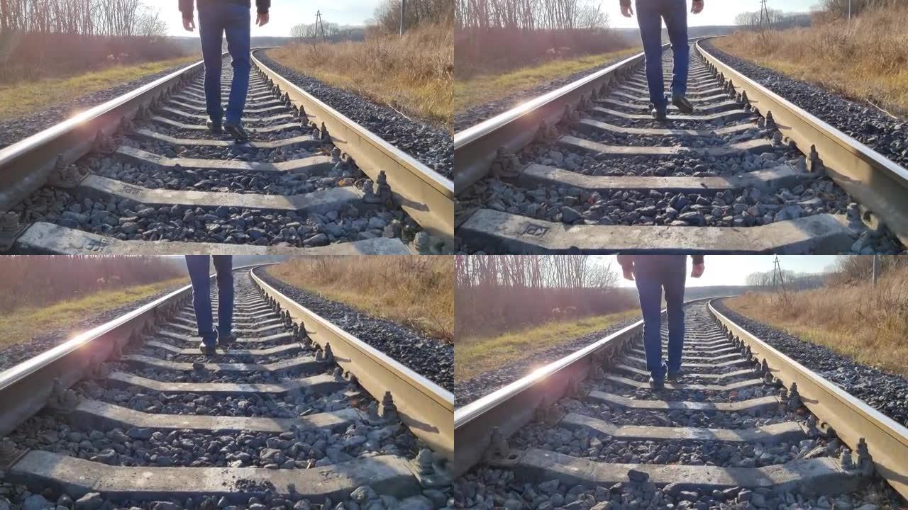 孤独概念。一个人沿着铁轨走，逃离自己。