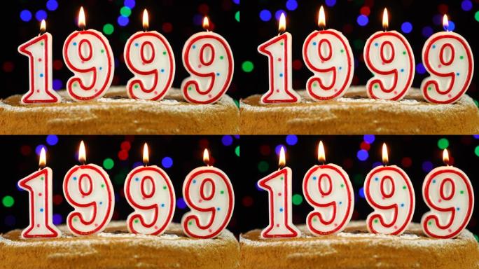 生日蛋糕与白色燃烧的蜡烛在数字1999的形式