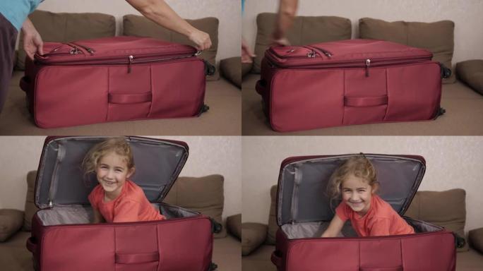 小孩在手提箱里玩。旅行车里的小孩。打包度假。快乐的儿童女孩游客从红色手提箱中寻找旅行度假冒险。孩子在
