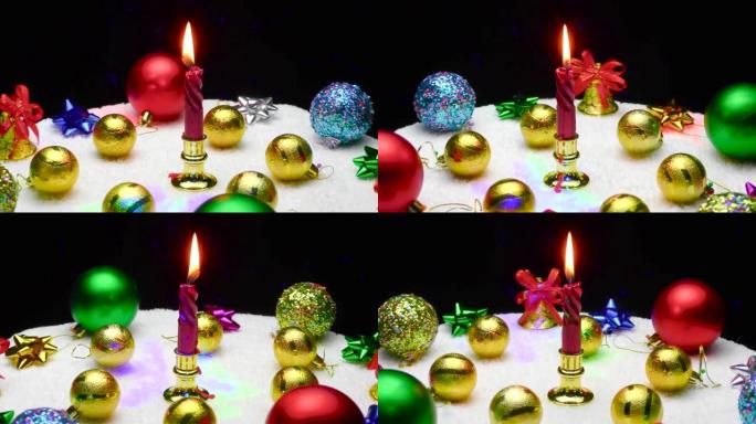 运动中的圣诞节在各种各样的彩色圣诞节装饰品中燃烧的蜡烛