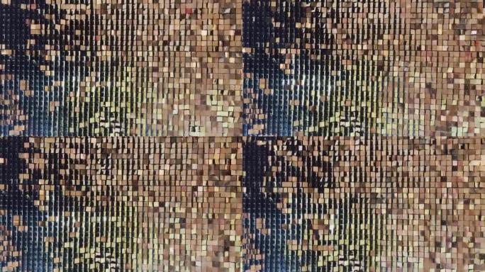 具有闪烁的金属或塑料颗粒壁的抽象背景，相同大小的颗粒形状，真实的镜头，一壁金色的火花在风中尖峰