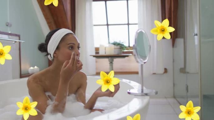 黄色花朵在混血儿女人身上的动画在家里沐浴保湿的脸上放松