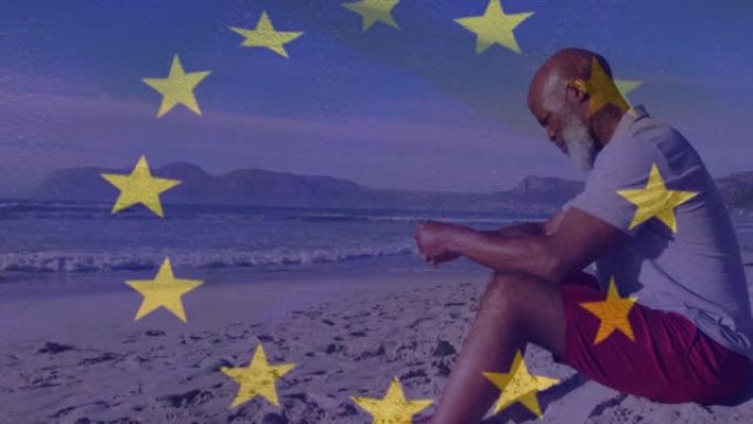 动画的高级黑人男子坐在海滩上欧盟旗