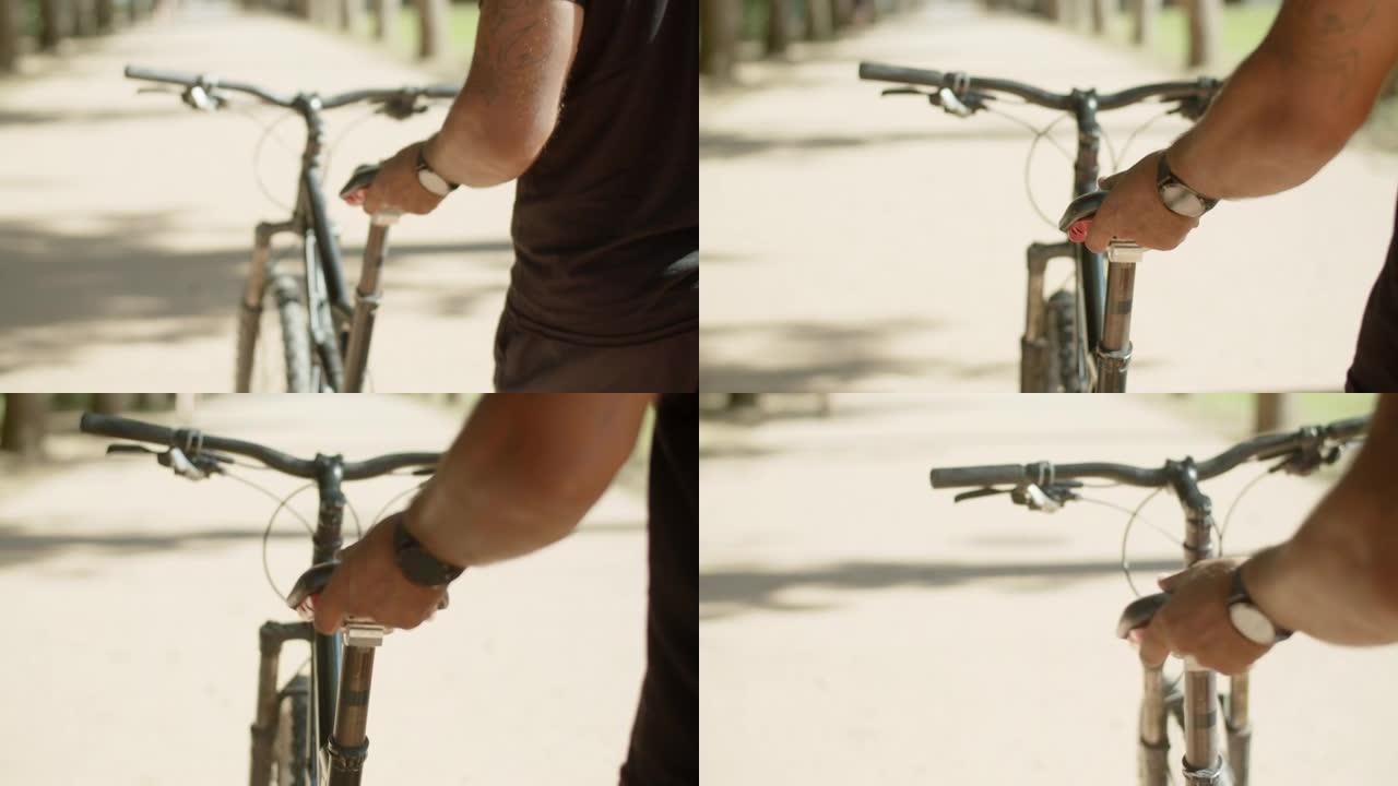 男子手握自行车座椅的特写镜头