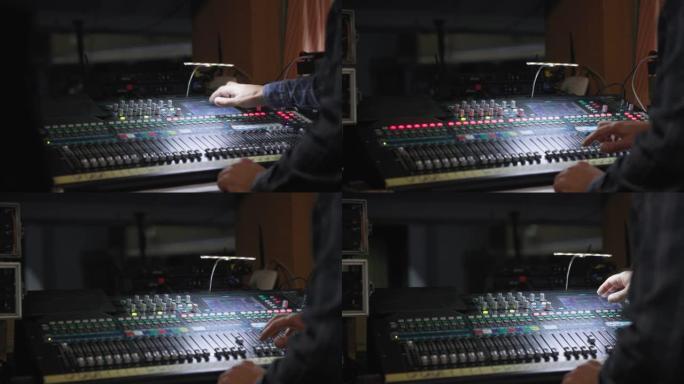 技术，sound producer hand正在使用带编辑工具的音频混合器，夜间专业录音棚