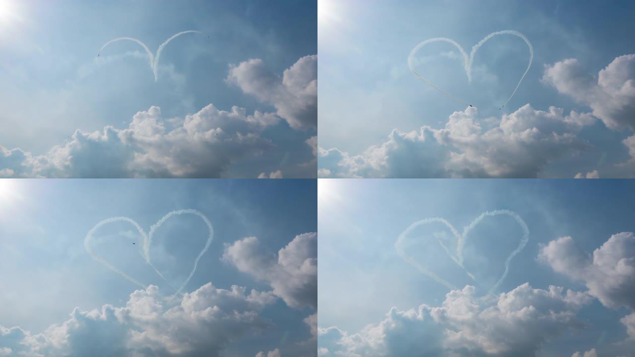一组三架飞机在多云的天空中充满了特技飞行的心脏形象
